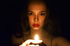 woman with magic candle