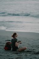 woman with camera on the beach in bali