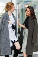 two fashion girls in coats