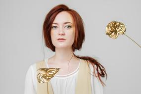 Young girl and gold flower