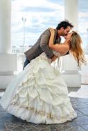 Bridge in the beautiful, white wedding dress, with the groom