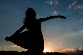 happy young woman at sunset