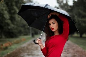 Girl in red with umbrella
