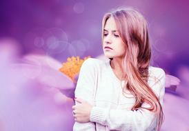 young girl with long hair on a purple background