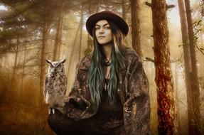 woman with owl in mysterious forest
