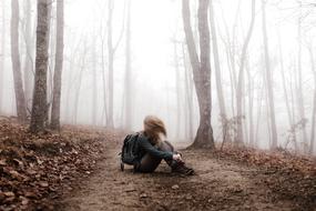 photo of woman in misty forest