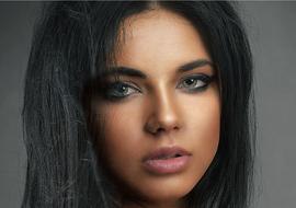portrait of a brunette with dark makeup
