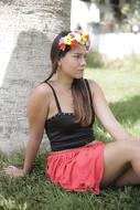 girl with flower wreath on the lawn