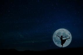 ballerina silhouette on the background of the full moon