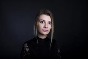 beautiful girl in black on a dark background