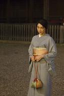 young asian woman in kimono posing in darkness, Japan, Kyoto, Gion