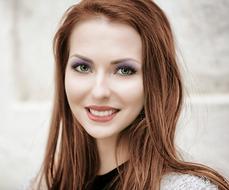 Portrait of pretty red haired young girl
