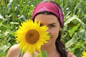 Sunflower at young Girlâs Face