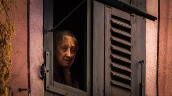 Loneliness, Old Woman looking from window