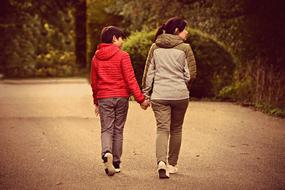 mother with her son on a walk in the park