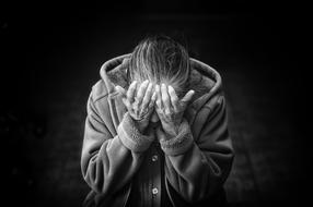 black and white photo of an elderly depressed woman