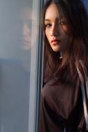 portrait of a young woman near the window