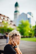 blonde girl close face with hands