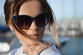 glamorous girl with sunglasses on the pier