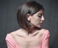 portrait of a beautiful girl in a pink dress