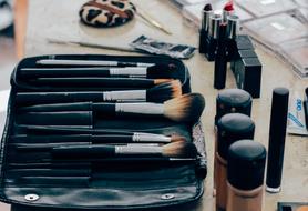 brushes and cosmetics on the table