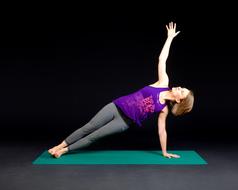 caucasian girl exercising on mat