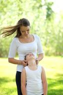 happy mom with daughter on nature background