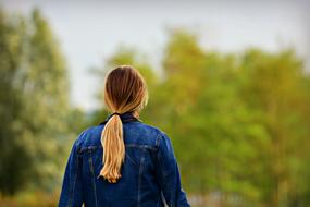 Woman on the landscape with the trees