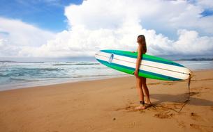 Surfing Girl Female on sand beach