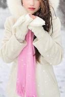 woman in white coat in winter