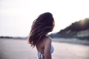yound Girl in swimsuit at water