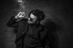stylish man in sunglasses and jacket, monochrome