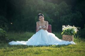 bride on a chair in the garden