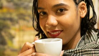 charming Woman with Coffee cup Smiling