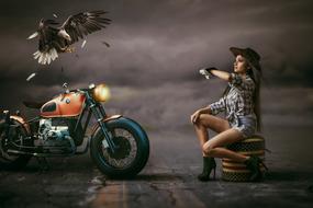 girl next to a motorcycle, eagle, night