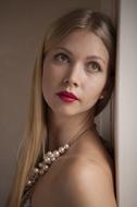 Portrait of beautiful Woman wearing pearl necklace