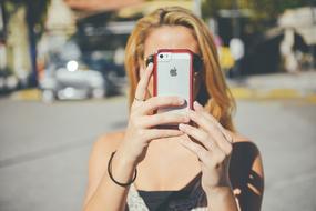 Girl Taking photo with Iphone