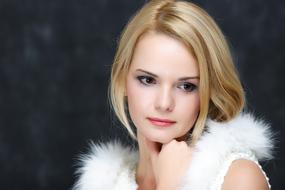 photo of a blonde with a fur collar
