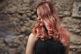 model with pink curly hair