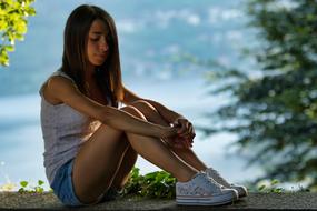 sensual young woman in sneakers