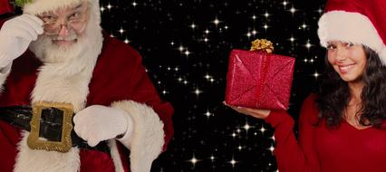 girl with a gift near santa claus