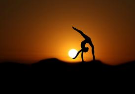 gymnast at sunset