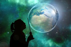 girl is blowing soap bubbles on a background of the colorful starry sky