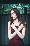 Girl with Long Hair posing with hands crossed on breast