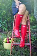 girl on the stairs in red boots