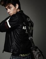 young man with Fashion Hairstyle in Leather Jacket