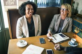 business meeting of two laughing women
