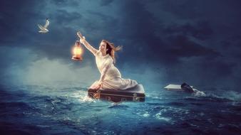 girl on a suitcase at sea