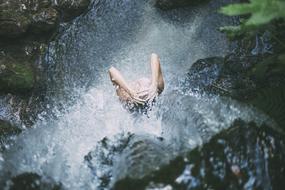 woman under the waterfall