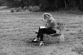 Woman Sitting on Bench, black and white